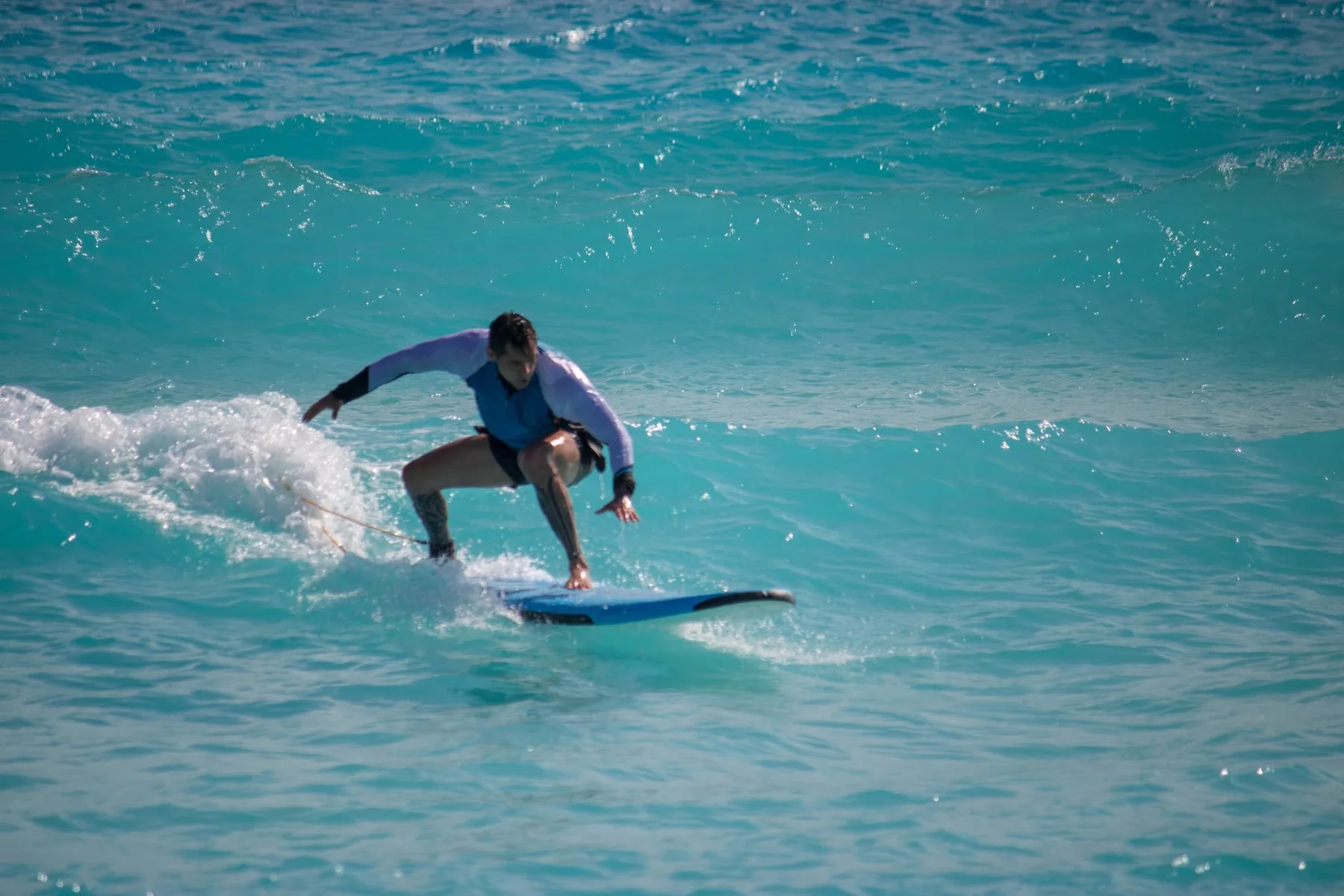 An AMS surfer at Playa Delfines.